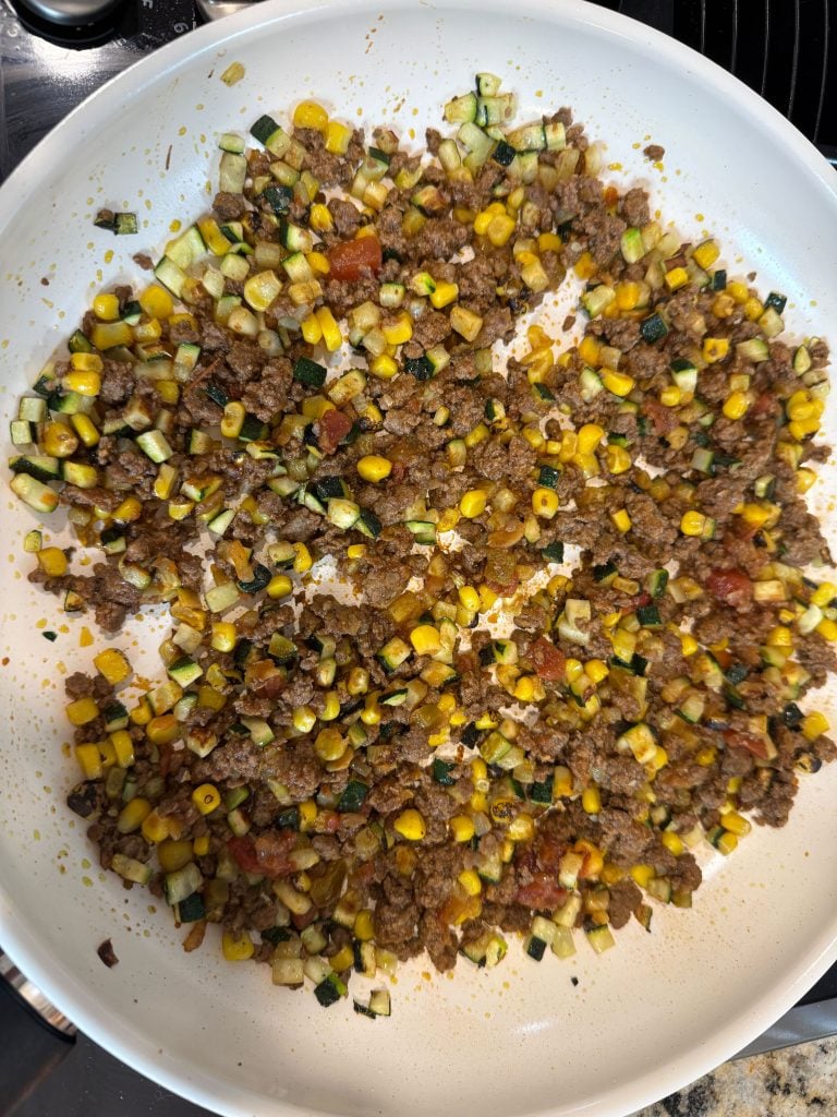 Ground chicken, corn and zucchini in a pan