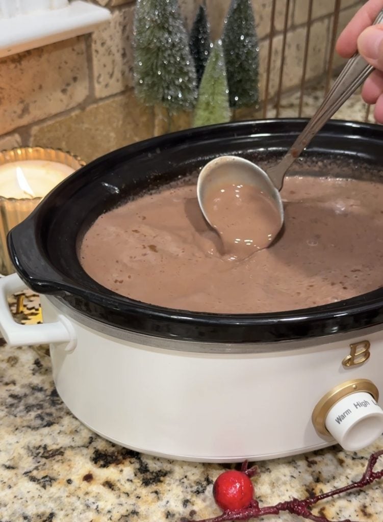 Slow cooker with hot cocoa in it