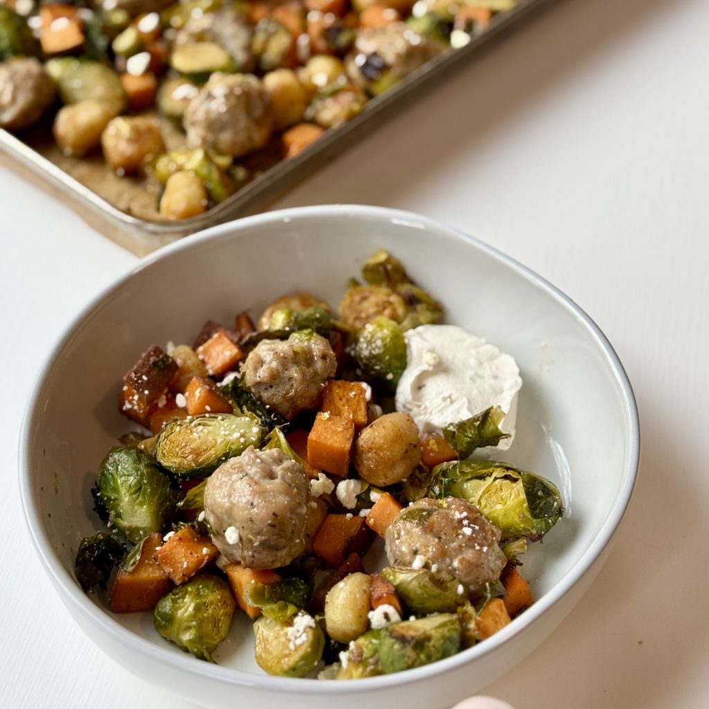 A bowl of chicken meatballs and vegetables on a table