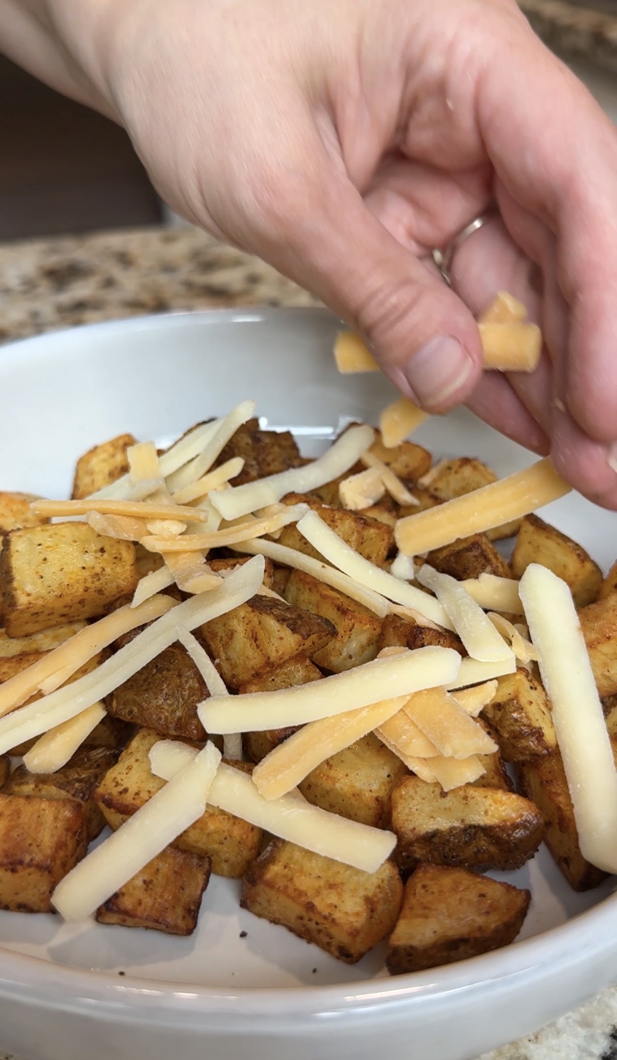 crispy air fried potatoes, topped with shredded Mexican cheese
