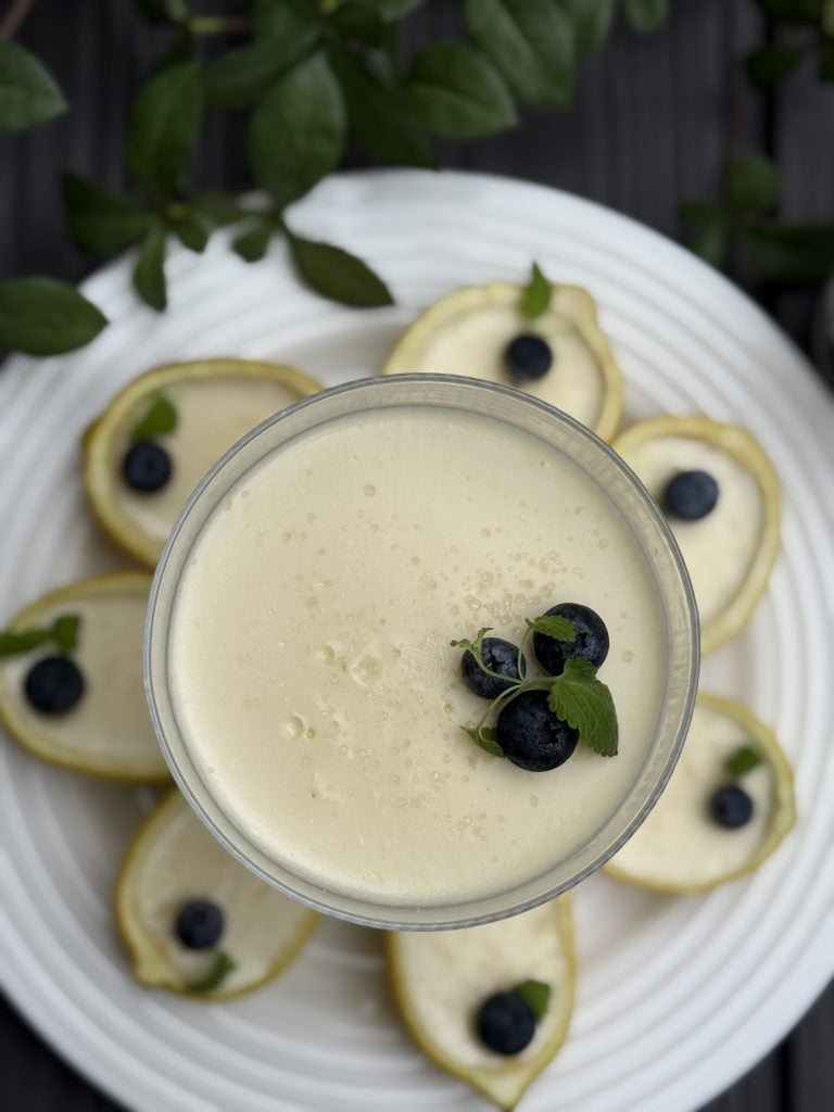 A white plate with lemon possets arranged on top of it