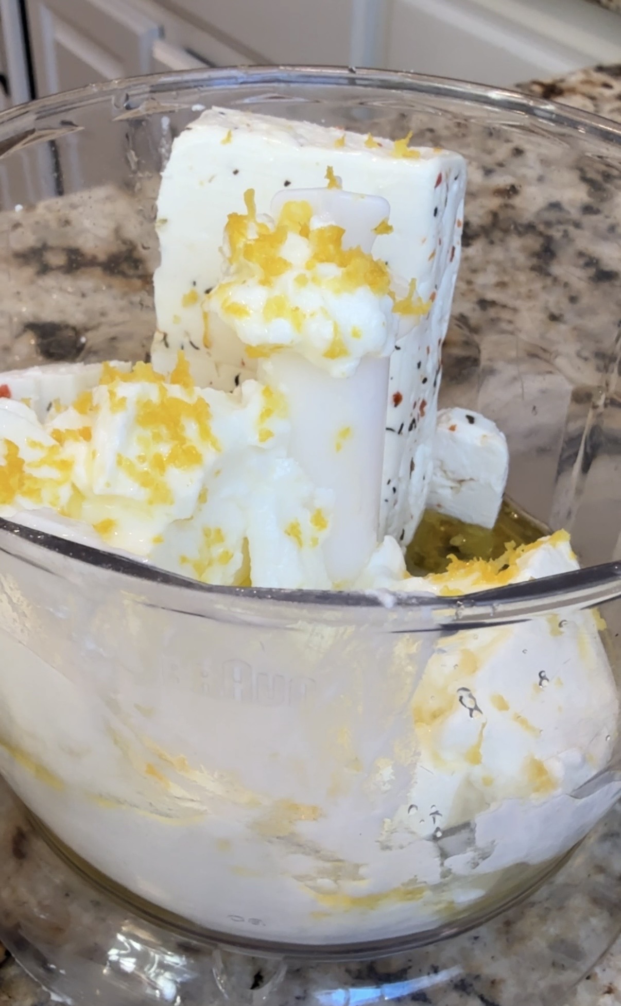 Food processor with feta block, lemon zest and greek yogurt