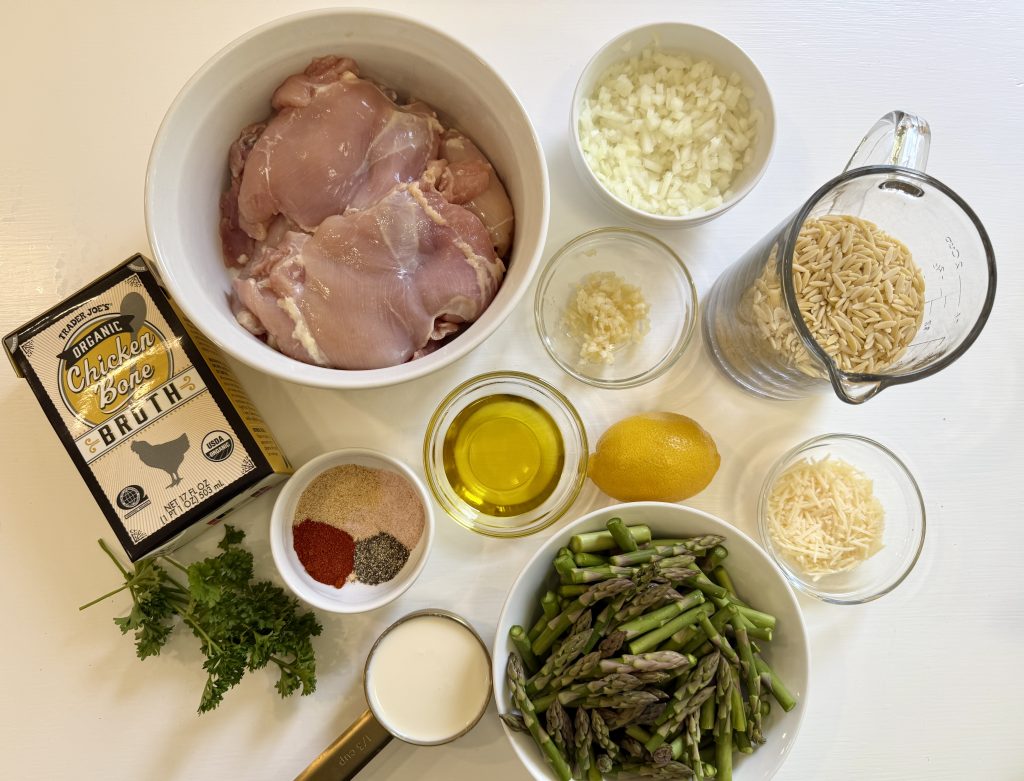 Ingredients on the table to make a simple lemon chicken and orzo recipe.