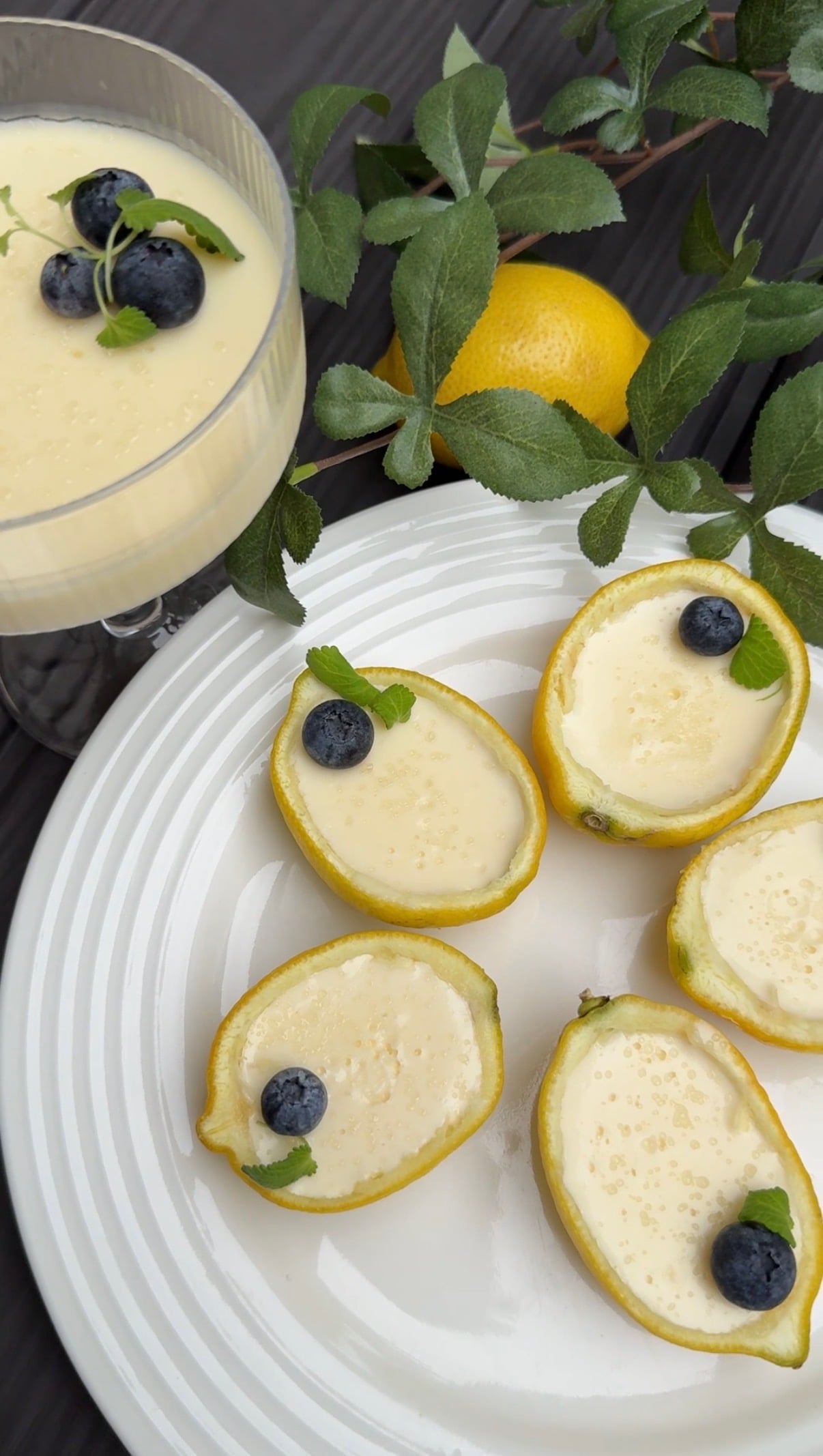 A white plate with lemon possets arranged on top of it
