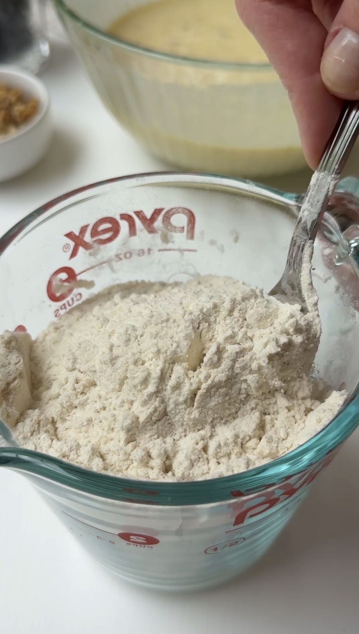 A spoon mixing the dry ingredients together.