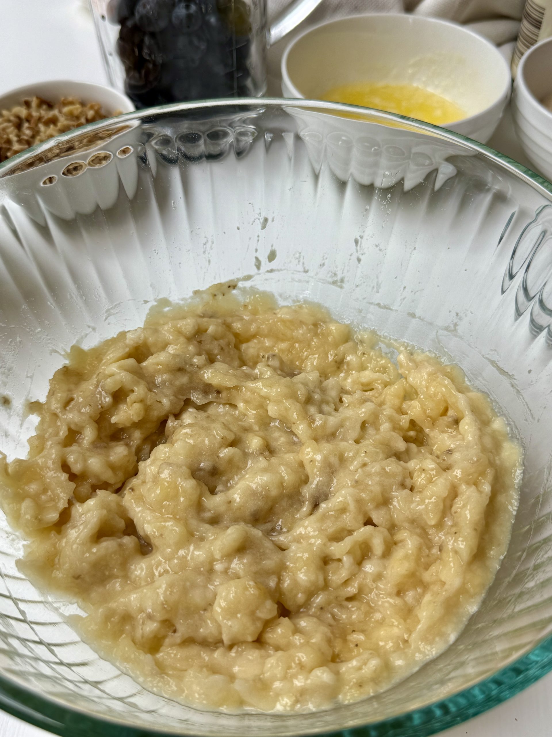 Bananas mashed in a bowl.