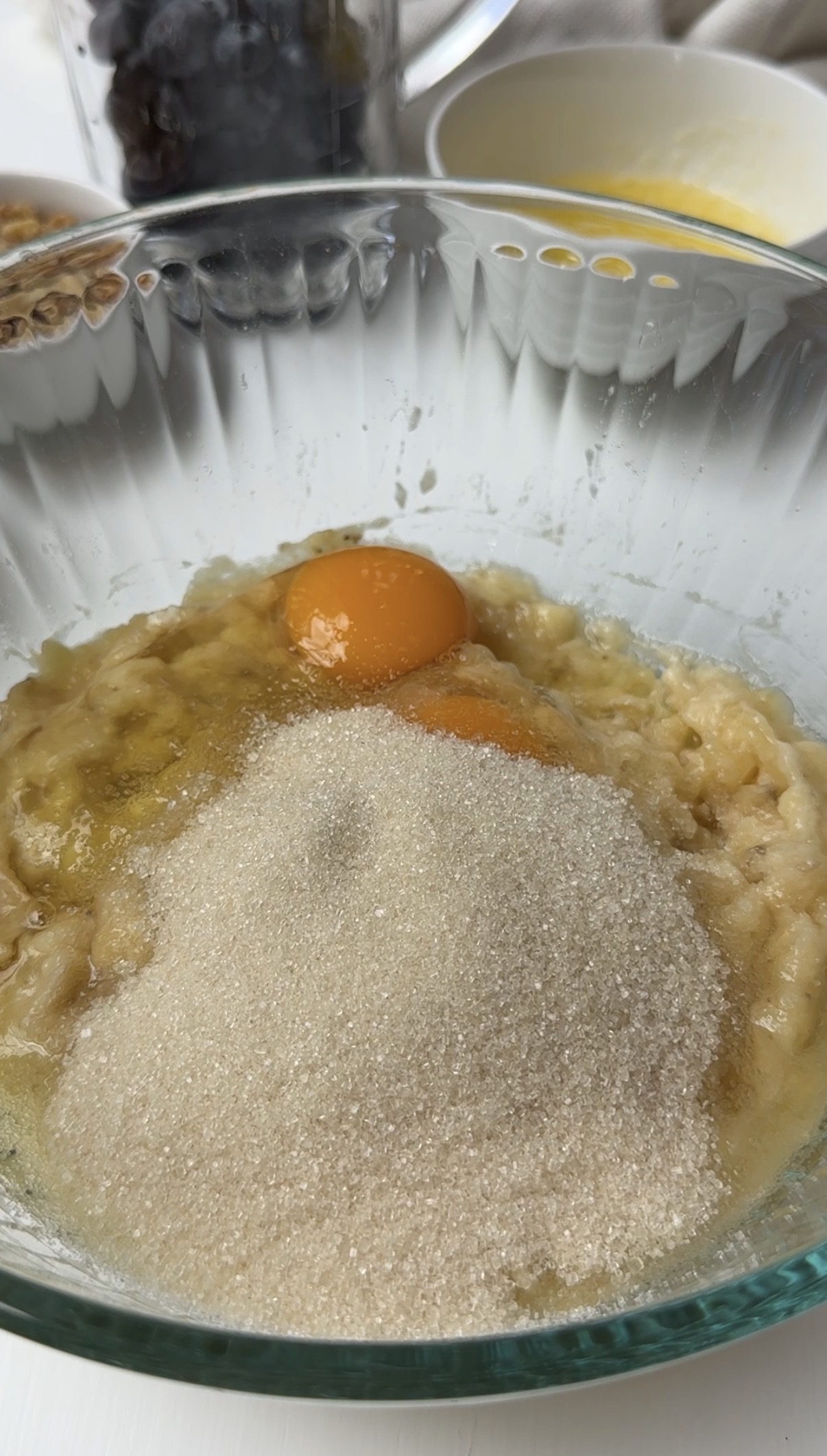 Egg and sugar added to the mashed bananas.