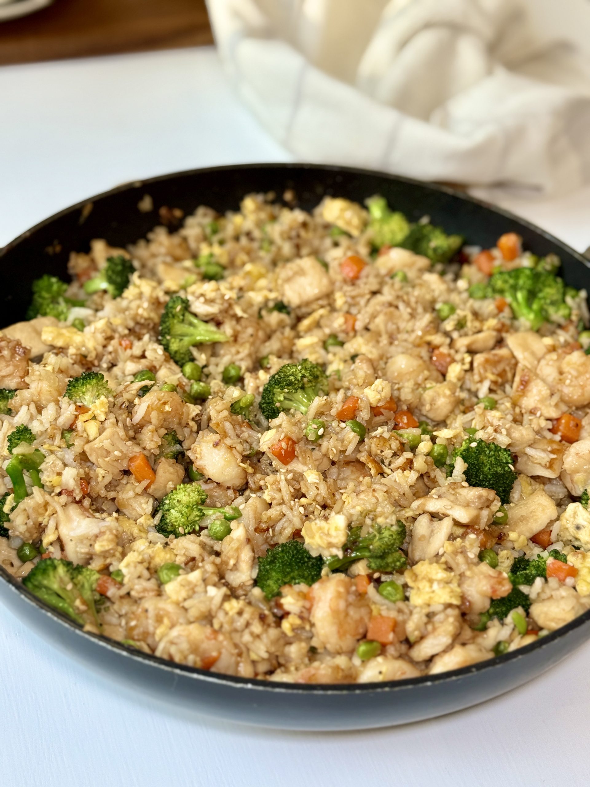 Chicken shrimp fried rice in a skillet after cooking.