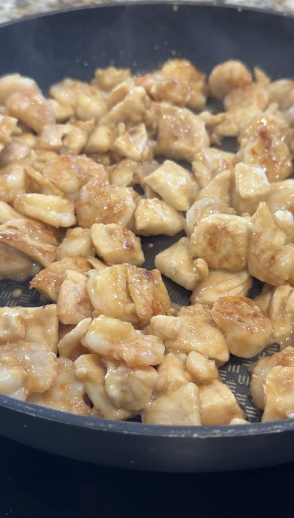 Cooking the shrimp and chicken.