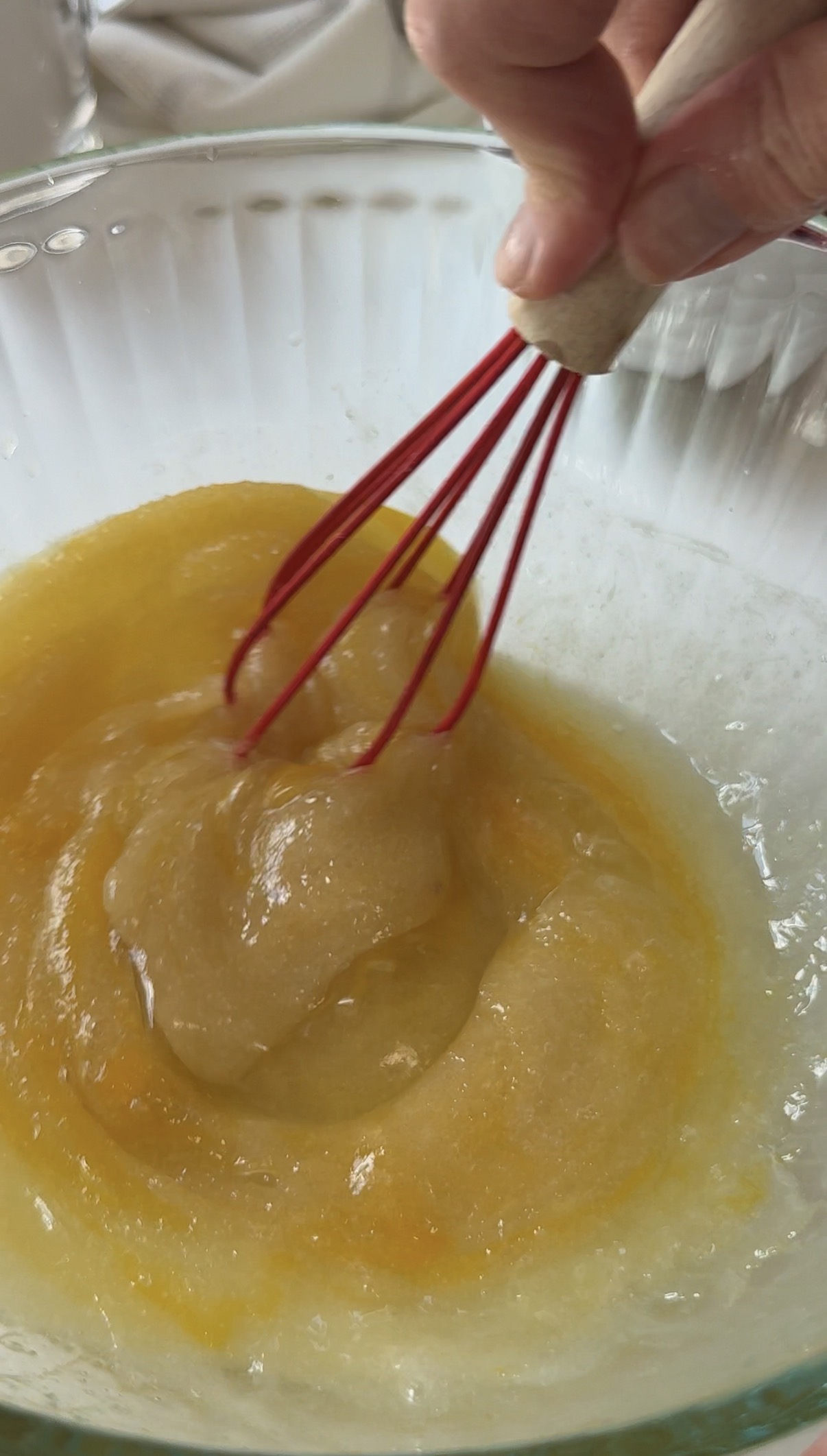 Wet ingredients to make raspberry and white chocolate blondies in a bowl.