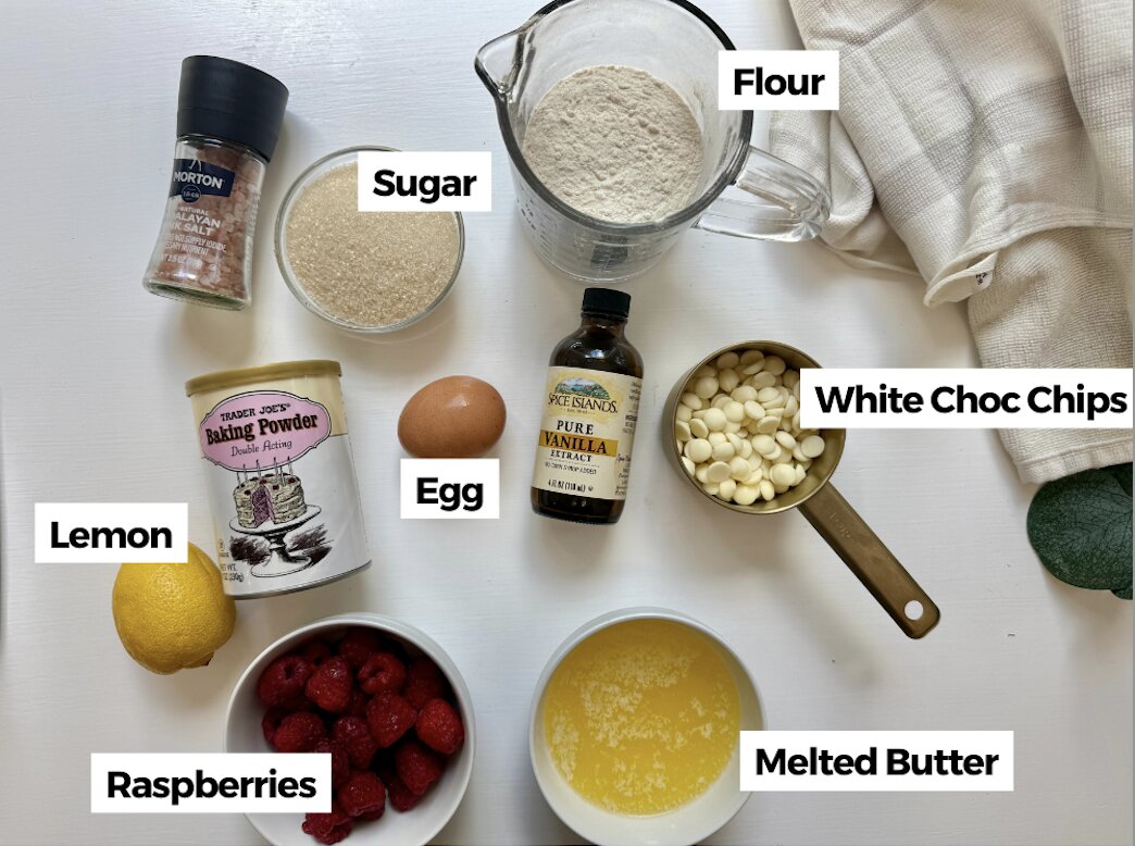 Ingredients to make white chocolate raspberry blondies on the table with labels.