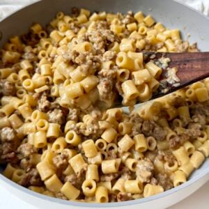 Creamy Italian sausage ditalini topped with freshly grated Parmesan and parsley in a skillet