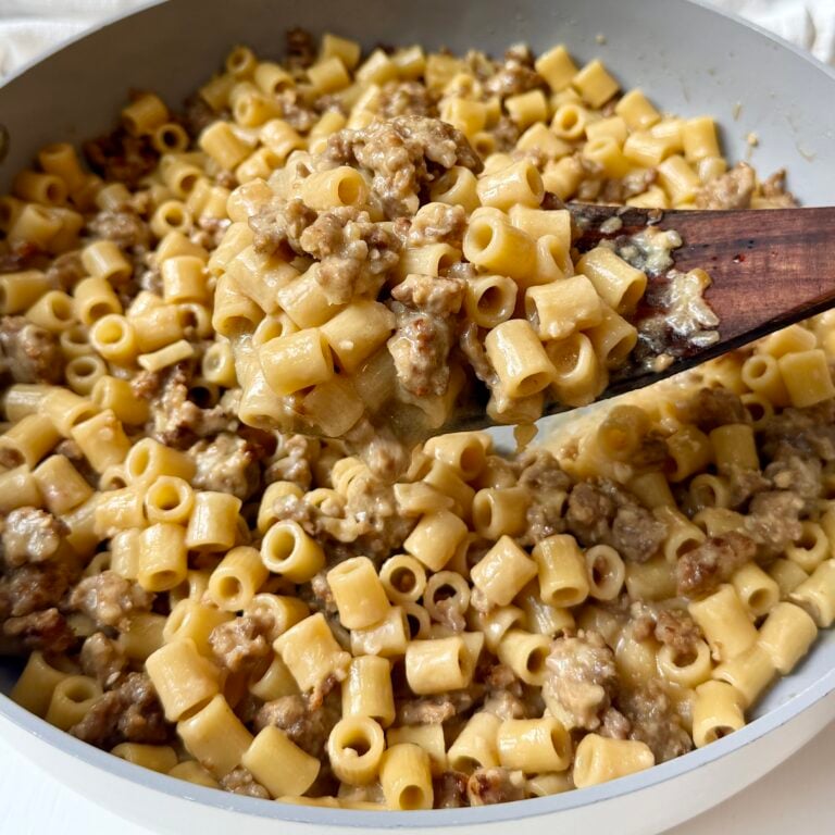 Creamy Italian sausage ditalini topped with freshly grated Parmesan and parsley in a skillet