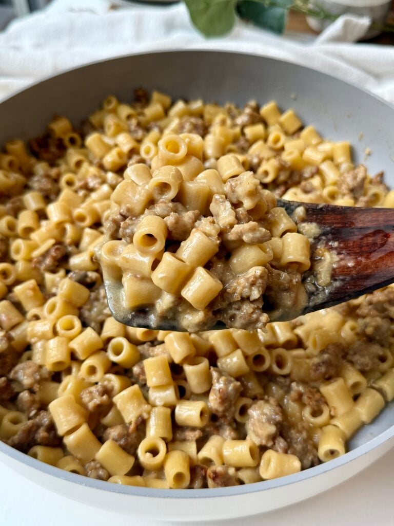 Creamy Italian sausage ditalini topped with freshly grated Parmesan and parsley in a skillet