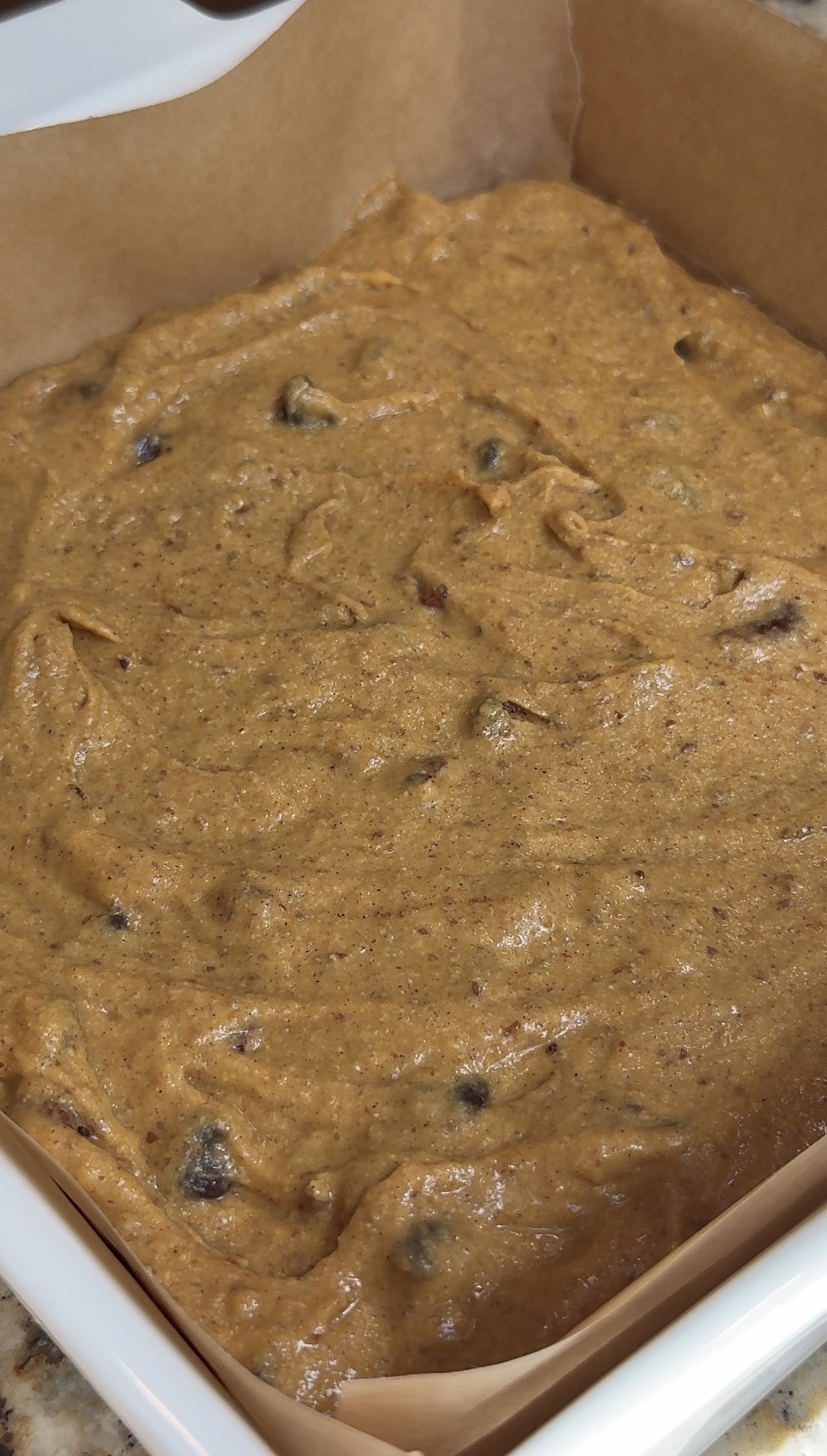 batter for the healthy pumpkin bars mixed with all the ingredients together and poured into the 9x9 baking dish