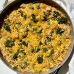 Healthy chicken broccoli rice casserole served up in a skillet.