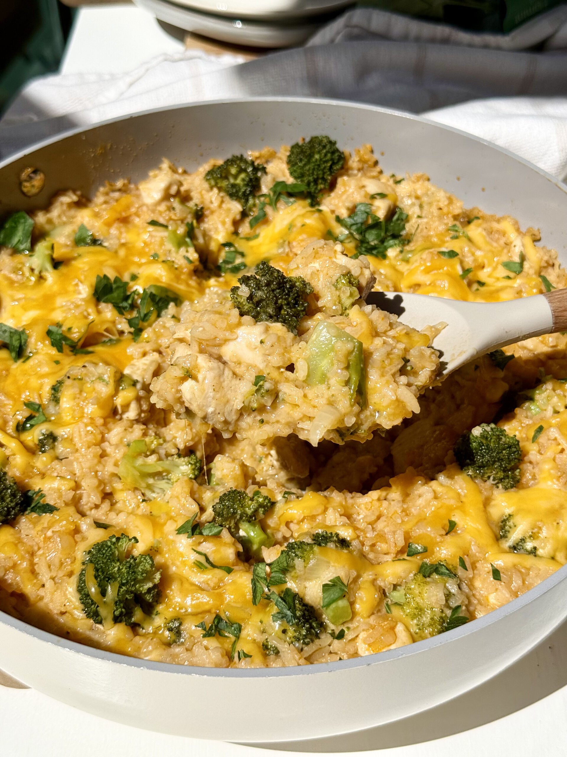 Chicken broccoli and rice casserole in a skillet.