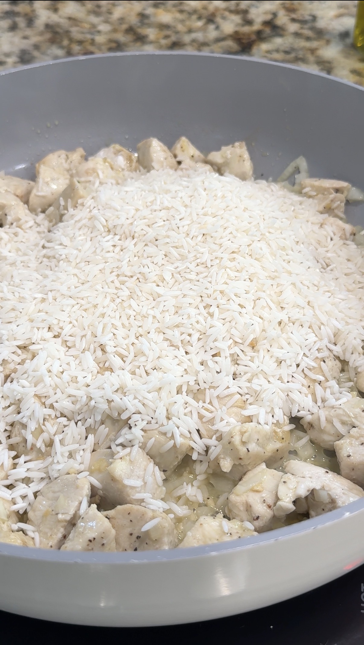 Rice added to the skillet.