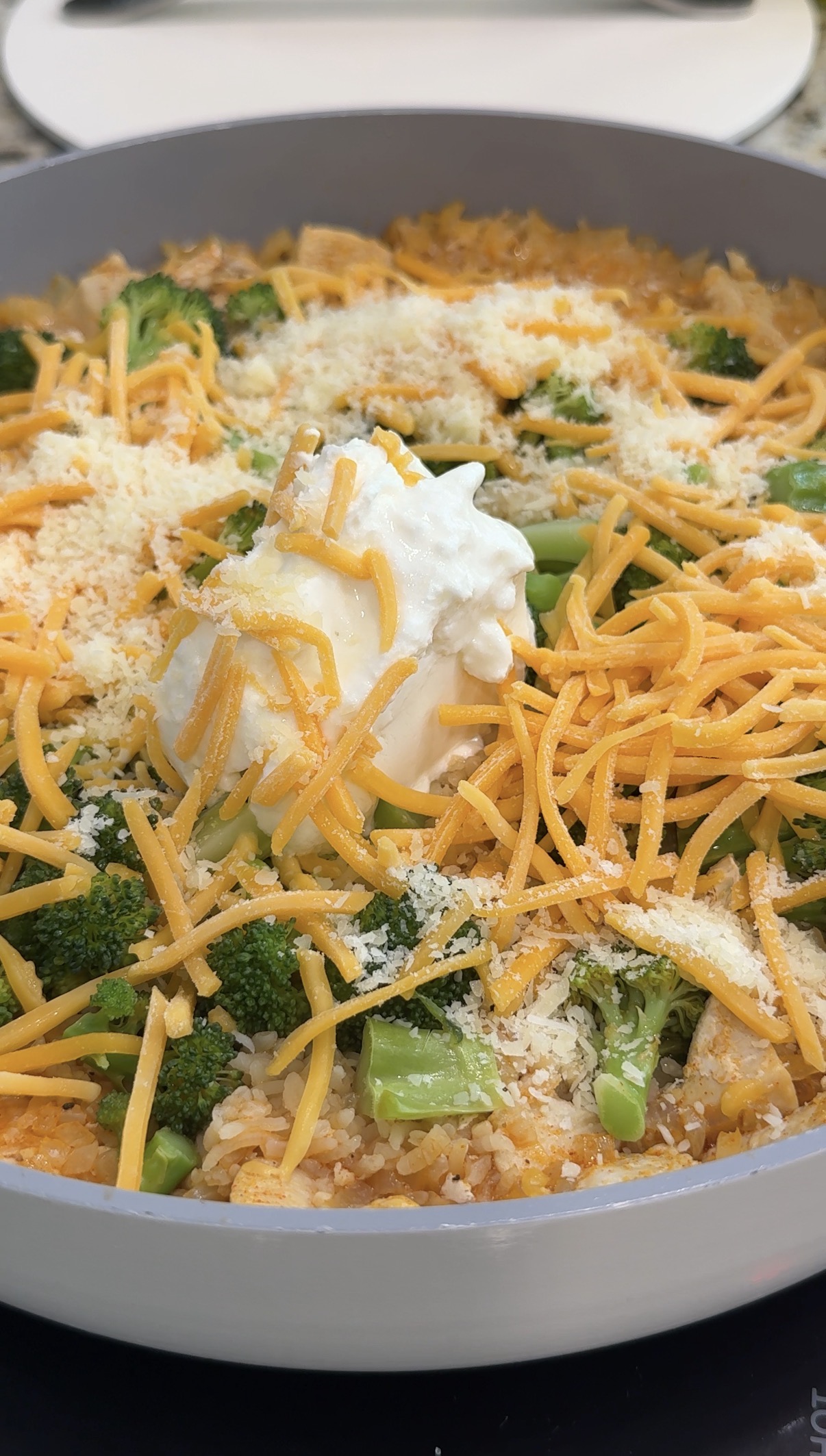 Cheese and yogurt added to finish the healthy broccoli chicken and rice casserole.