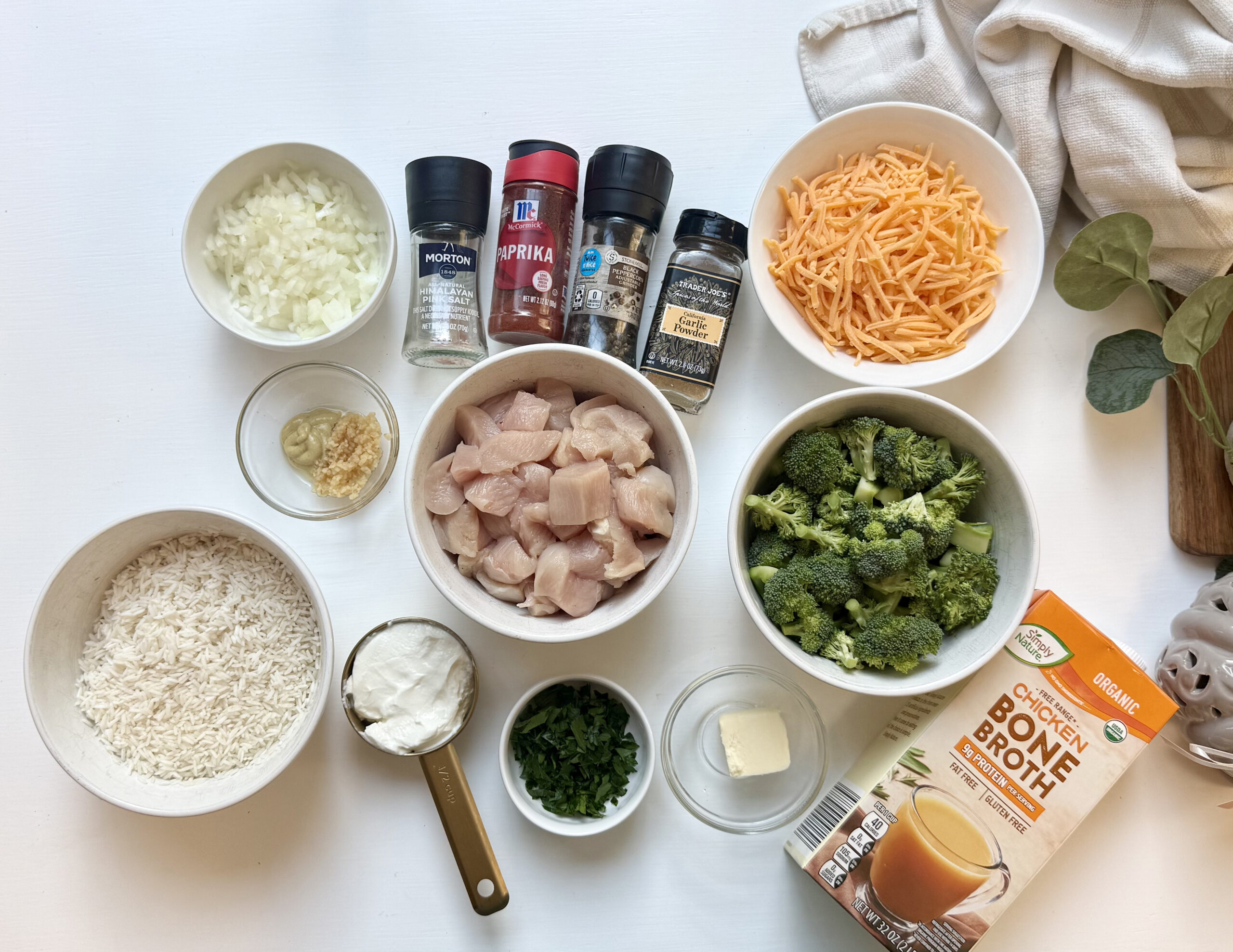 Ingredients to make chicken and rice casserole with broccoli.