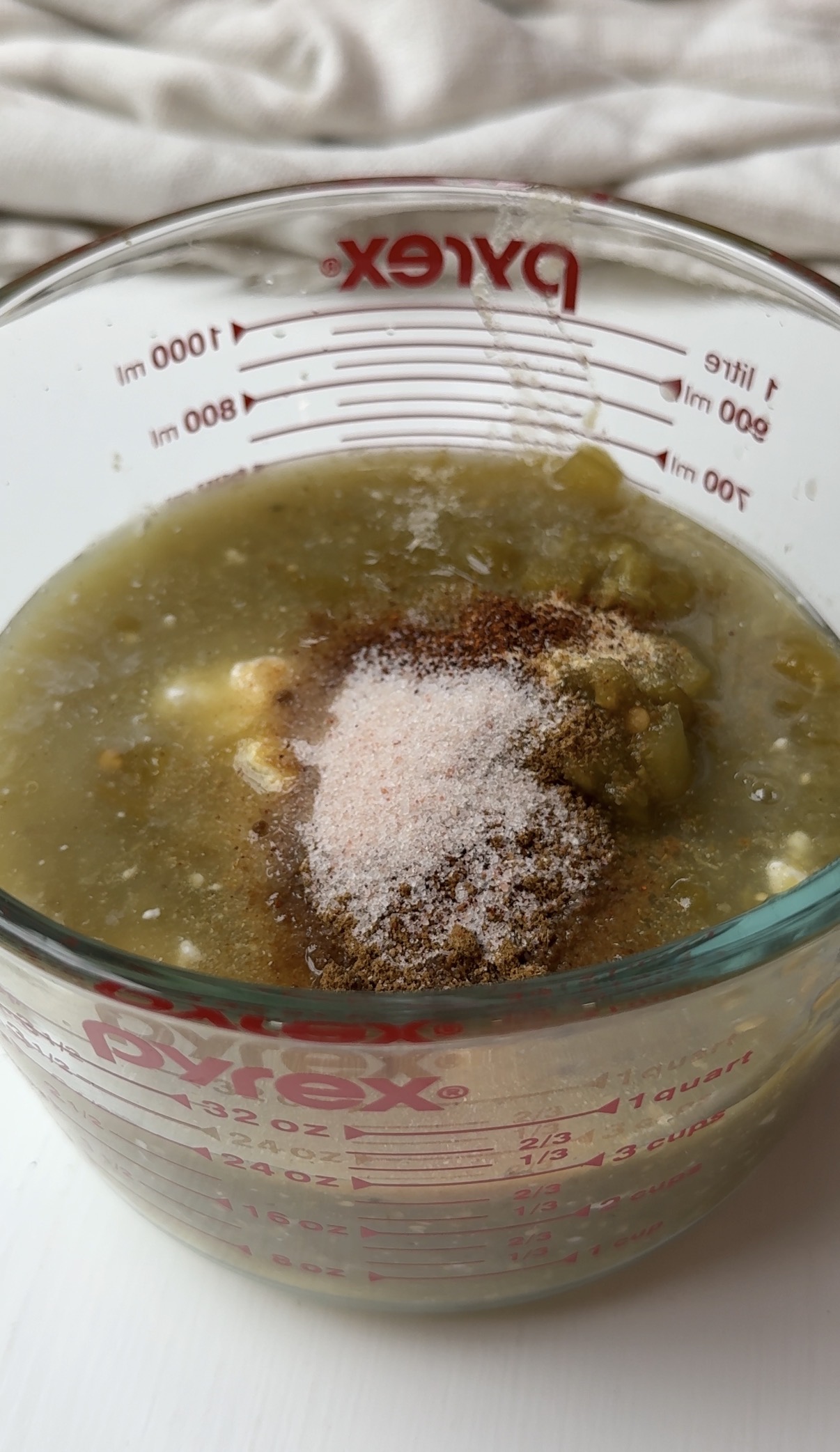 Sour cream chicken enchilada sauce ingredients in a dish. 