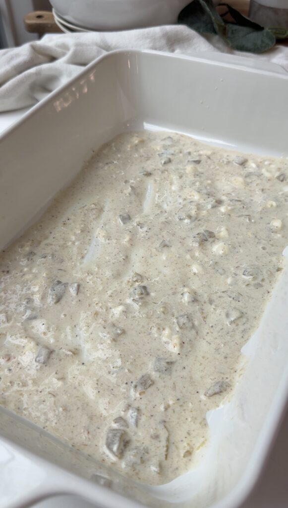 Sauce poured into the baking dish to coat the bottom.