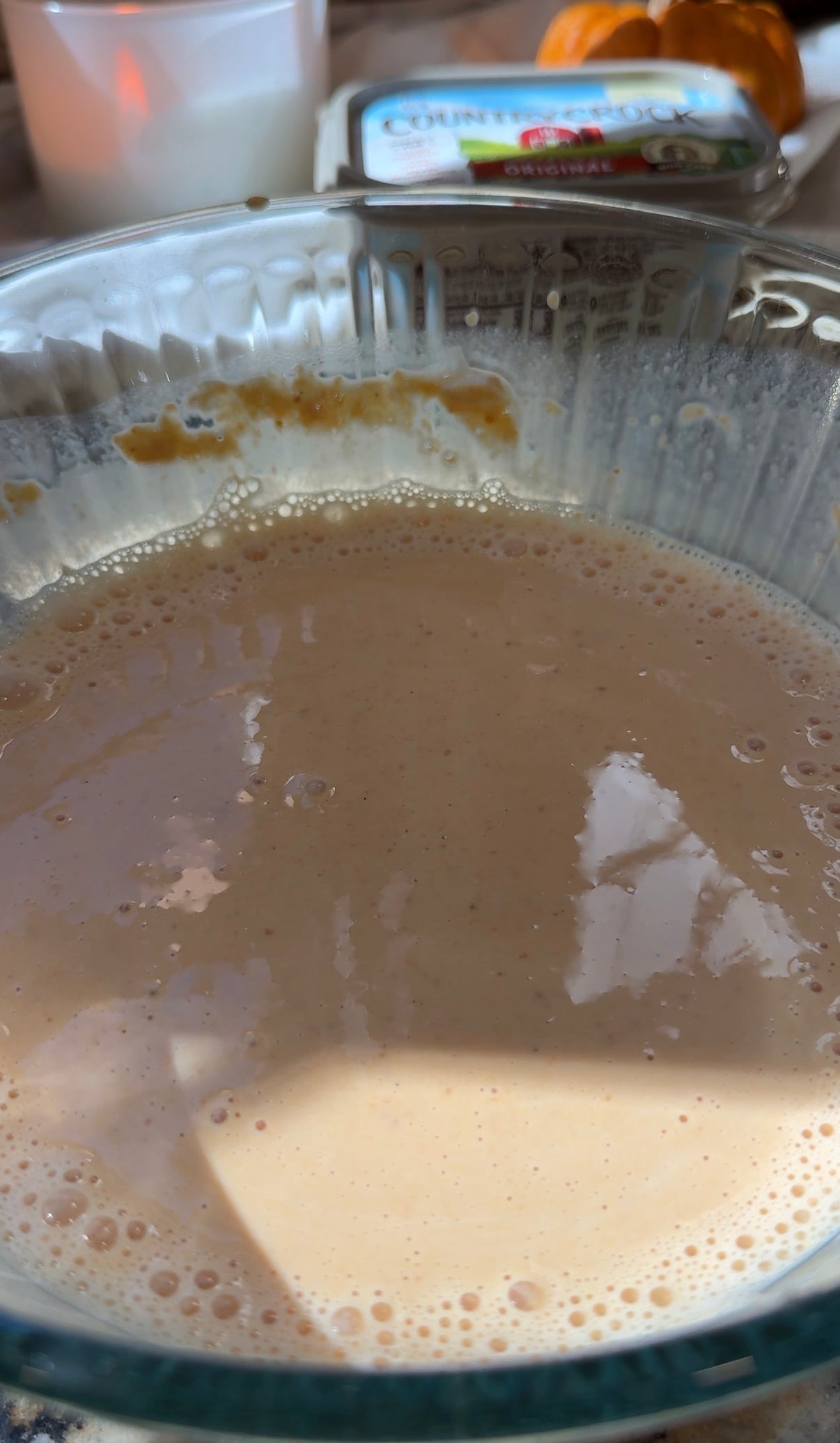wet ingredients for the pumpkin pancakes in a glass bowl