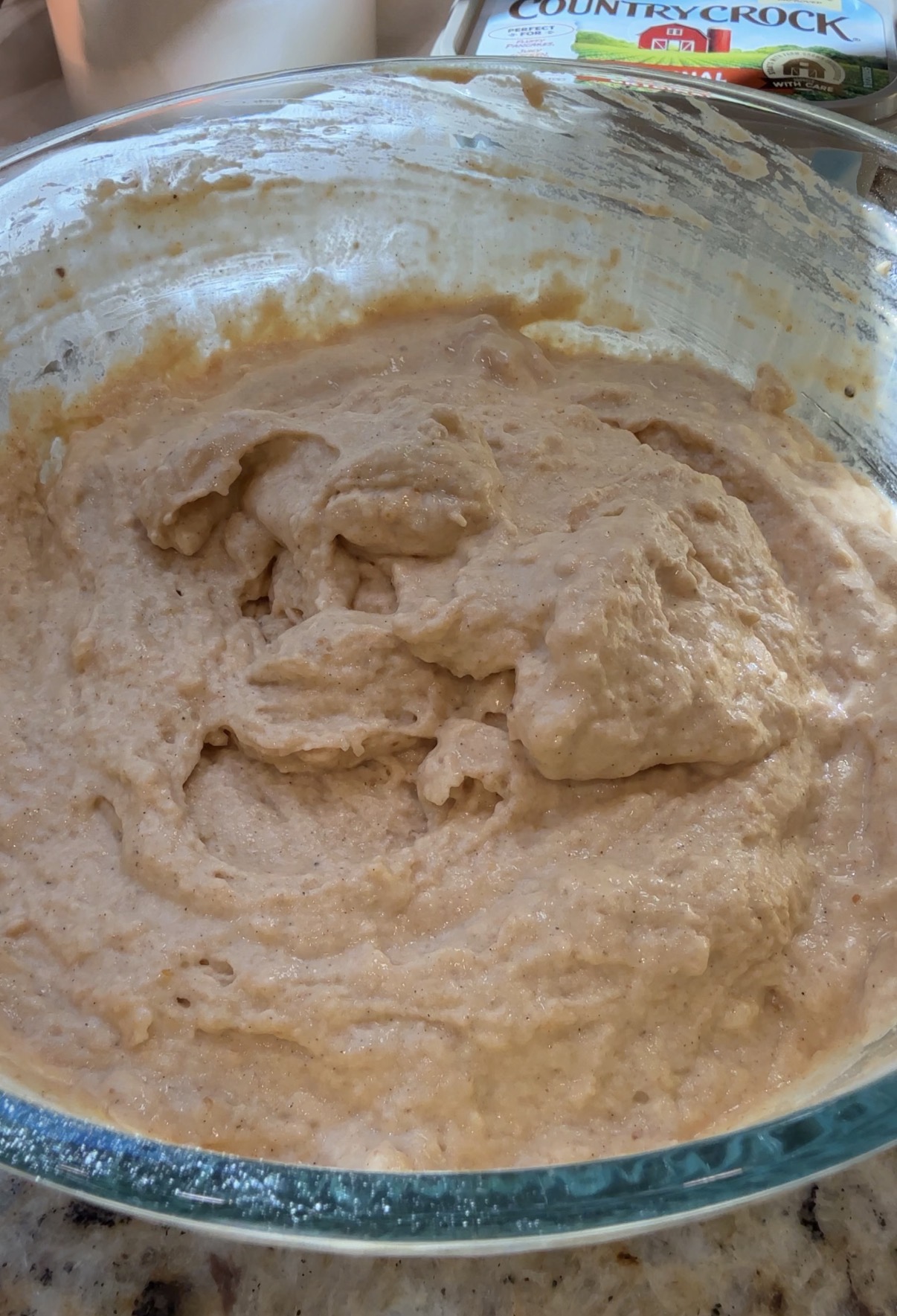 pumpkin pancakes batter in a glass bowl