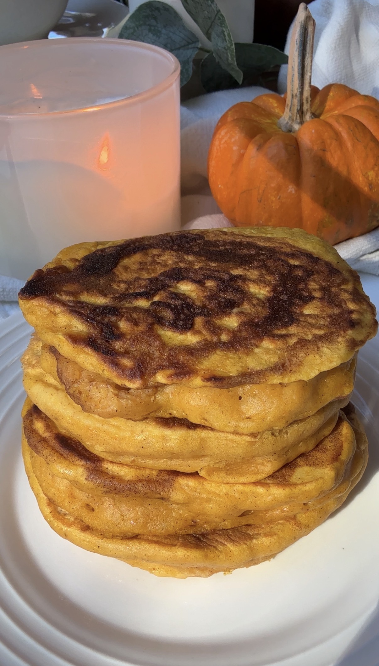 a stack of pumpkin cinnamon pancakes on a plate