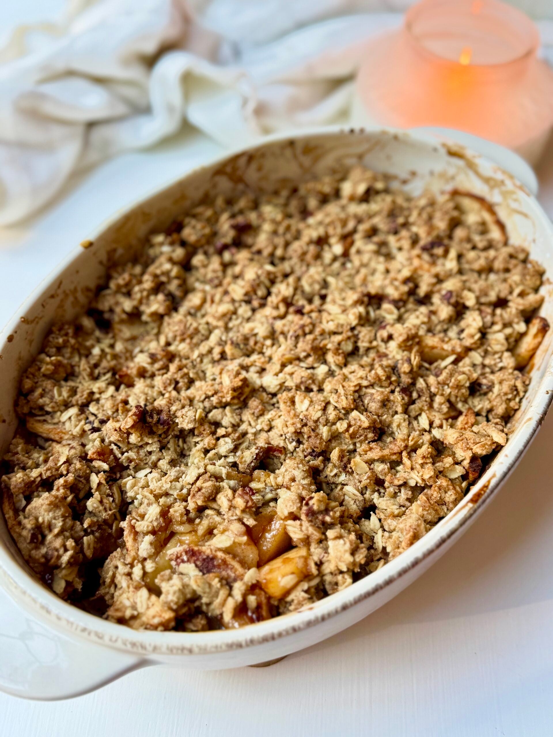 Easy apple crisp with fresh cinnamon apples and a golden oat and pecan crumble topping baked in a baking dish