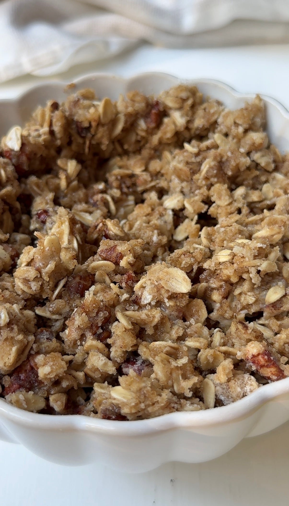 Buttery apple crisp topping made with rolled oats, chopped pecans, brown sugar, and cinnamon