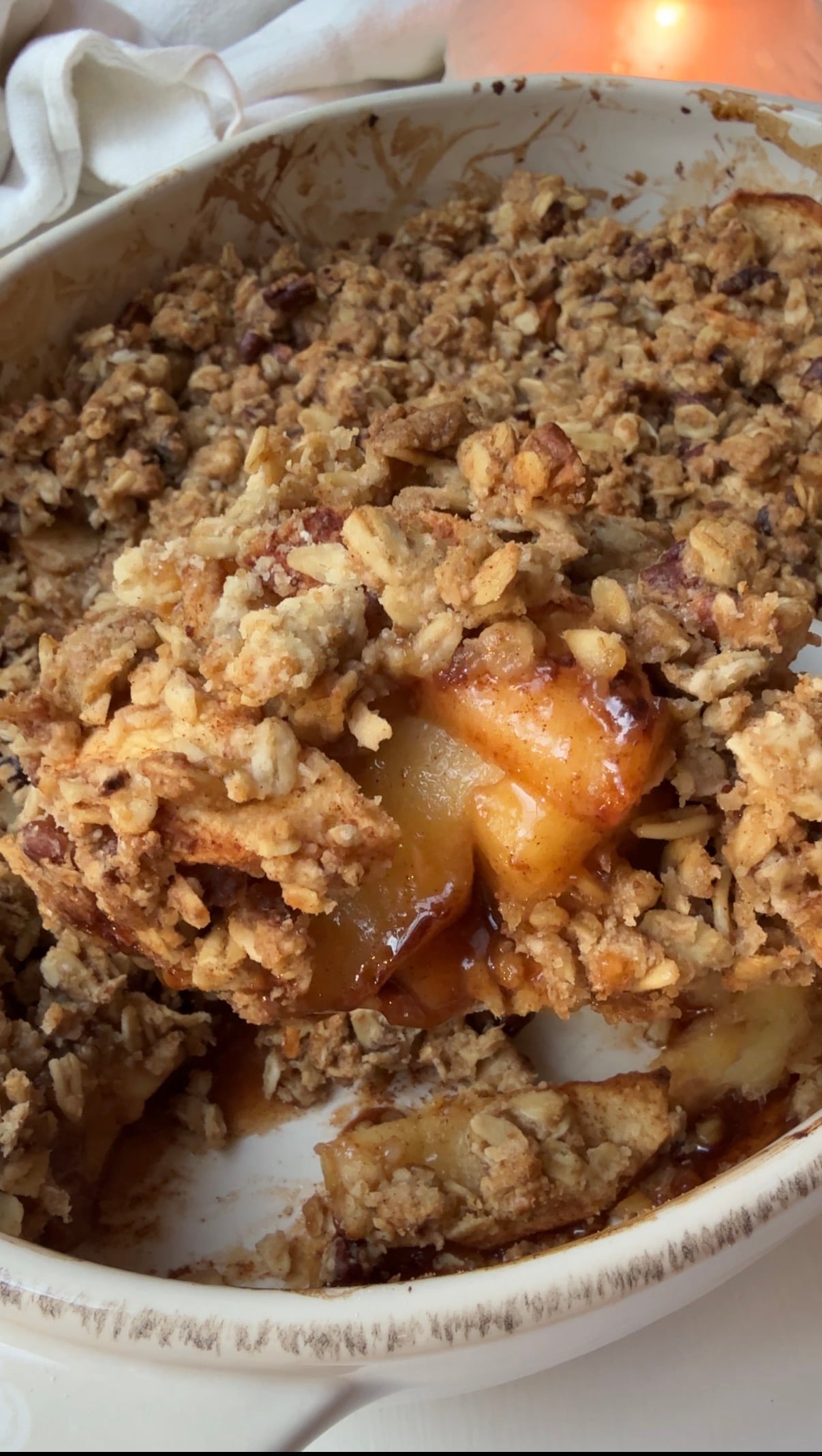 Homemade apple crisp with oats and pecans, baked until golden brown and bubbling
