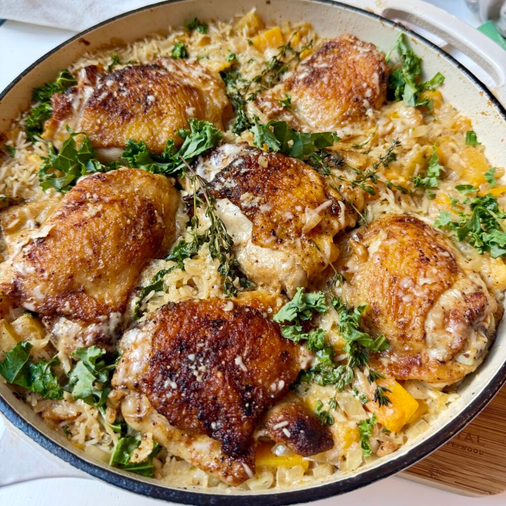 One-pan chicken and rice with butternut squash, kale, and creamy Parmesan sauce
