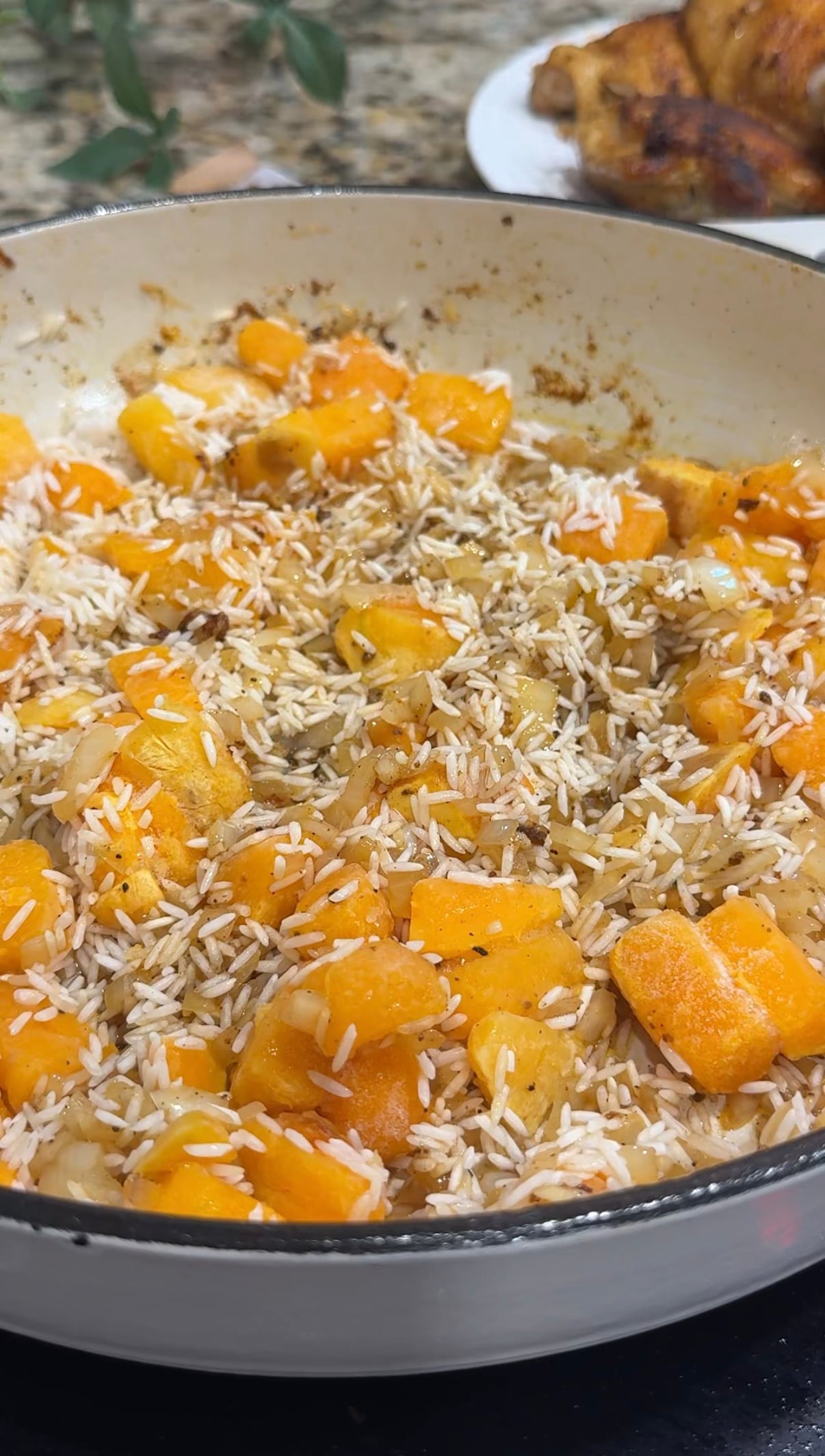 Rice and butternut squash getting toasted in a pan